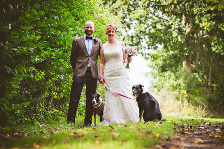 wedding couple with dogs at tithe barn